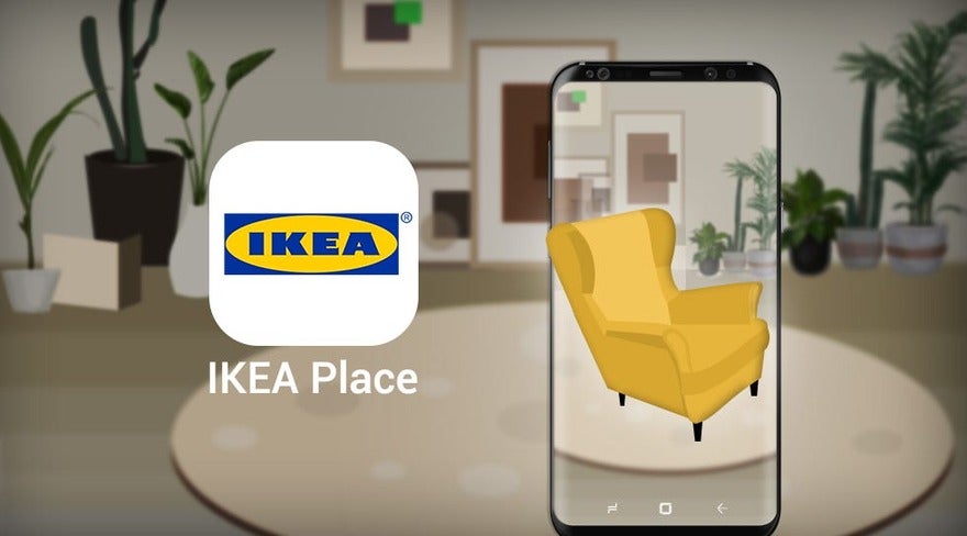 An illustration of a smartphone displaying an augmented reality app with a yellow armchair superimposed onto a living room setting, with the IKEA Place app logo above.
