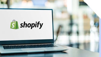 Laptop with a Shopify logo