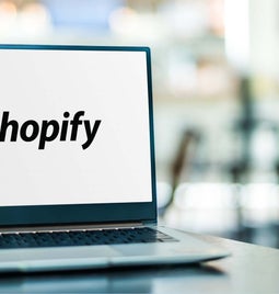 Laptop with a Shopify logo