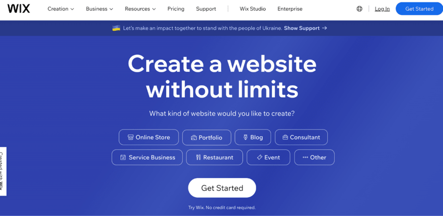 A screenshot of the WIX website homepage with a blue background. The header includes options like Creation, Business, Resources, Pricing, Support, Wix Studio, Enterprise, Log In, and Get Started. A banner offers support to the people of Ukraine. The main section says "Create a website without limits" and asks, "What kind of website would you like to create?" with options such as Online Store, Portfolio, Blog, Consultant, Service Business, Restaurant, Event, and Other. A 'Get Started' button is below, with a note that no credit card is required.