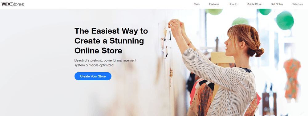 Wix eCommerce landing page with woman hanging necklaces on a wall